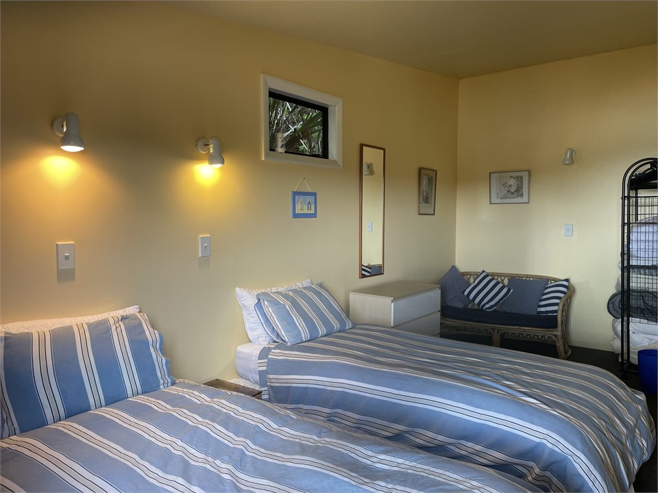 Outside access bedroom showing single beds