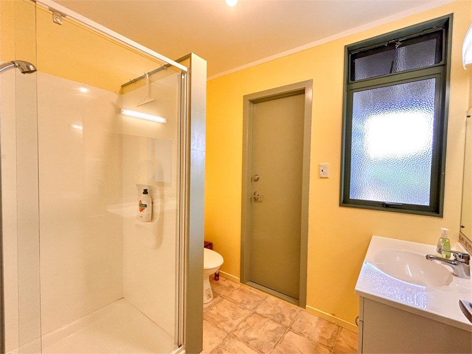 Downstairs Bathrrom with Shower, basin & toilet