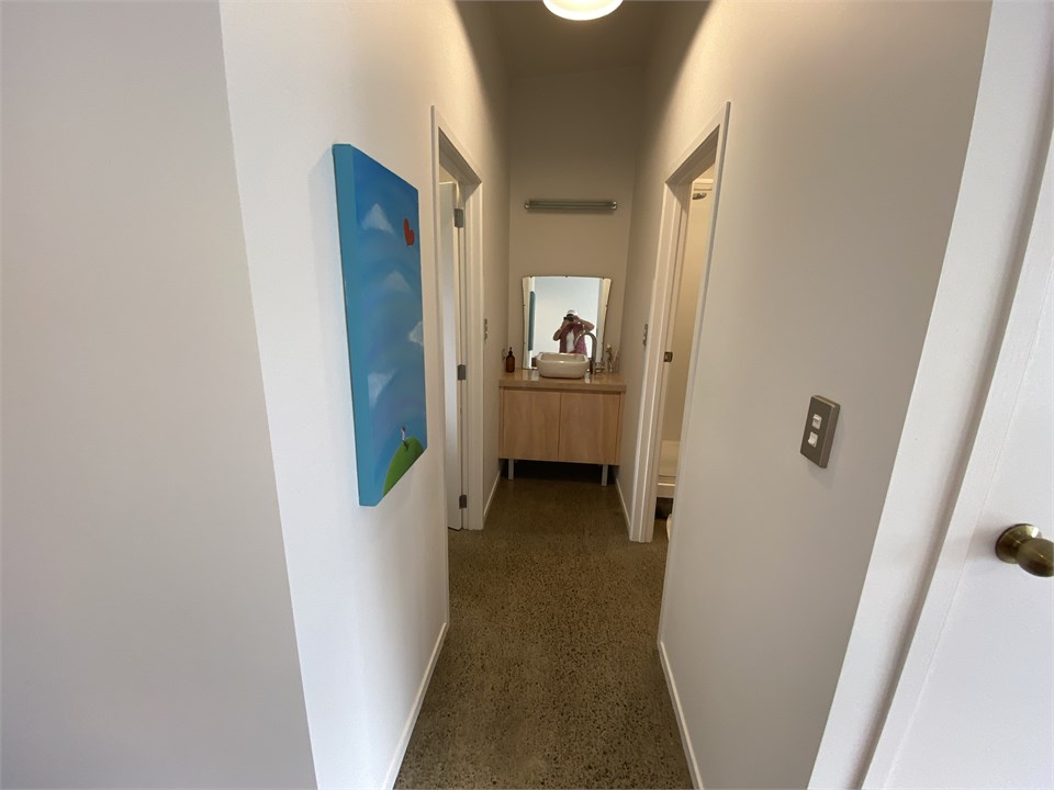 Basin between shower room amd laundry/toilet room