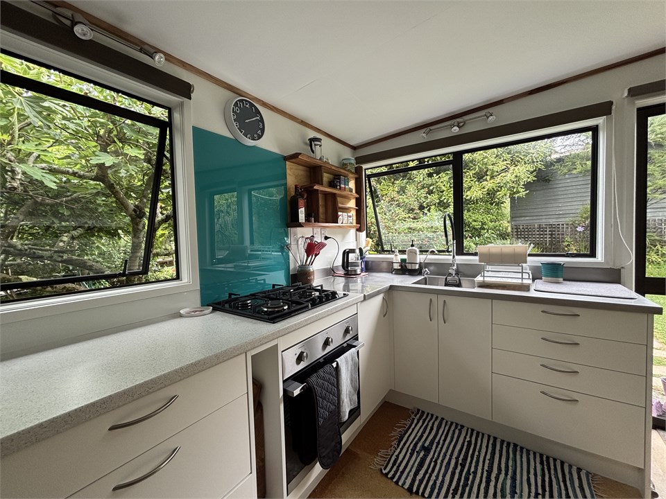 Kitchen with oven and 4 burner gas hob