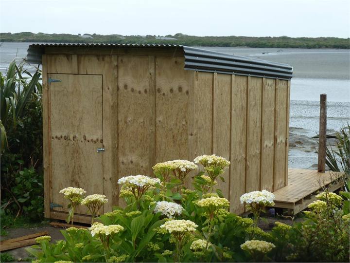 Boat shed with 4 kayaks