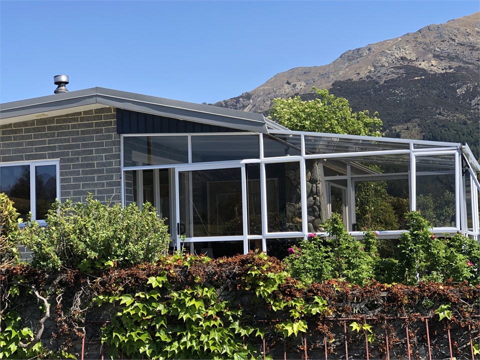 Side on view of house and conservatory