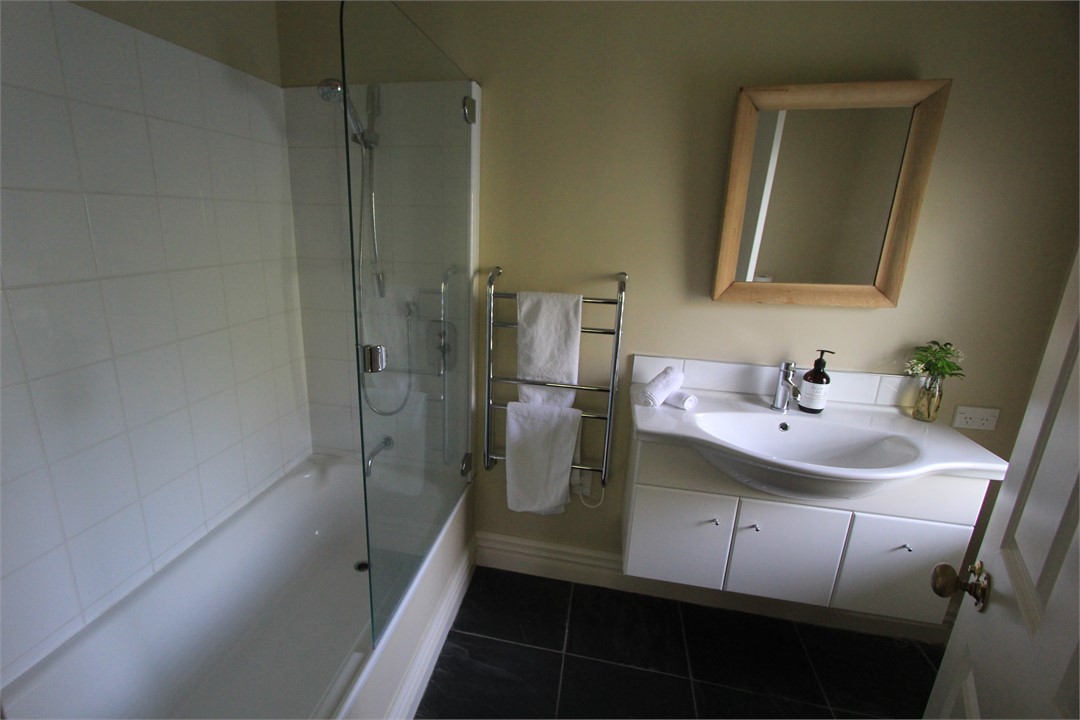 Ensuite for the Buddha room includes a bath