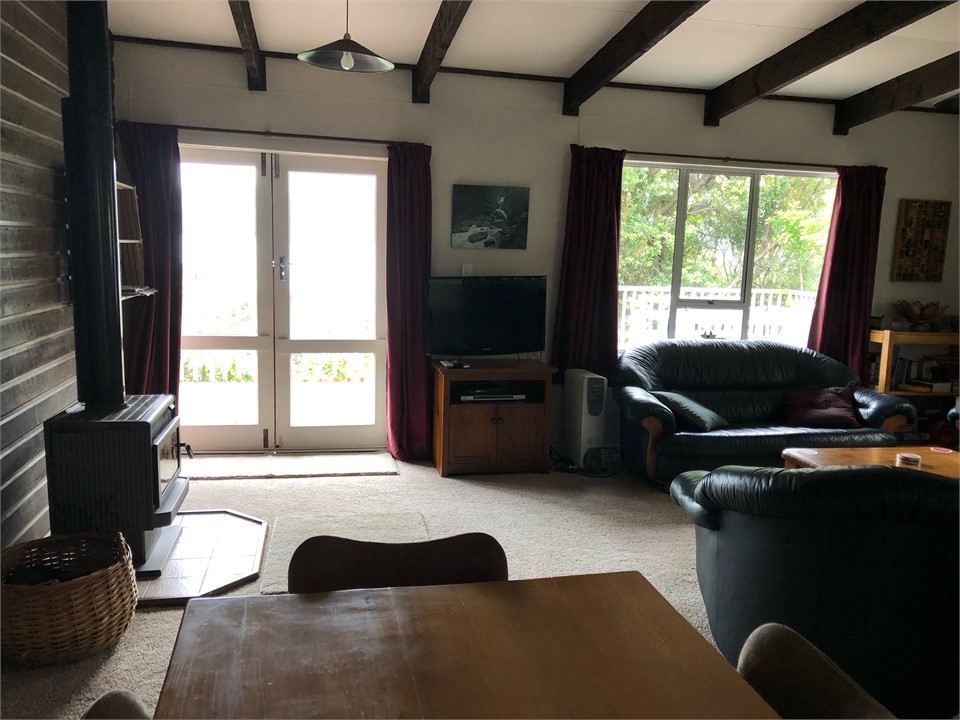 Living and door to deck