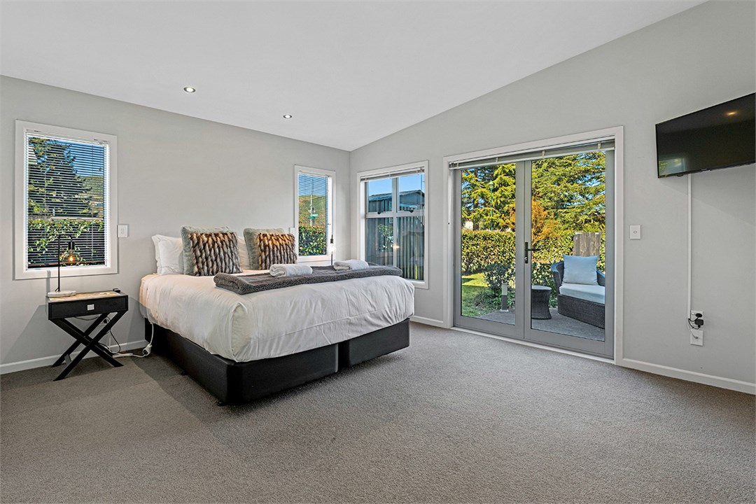 Master bedroom with king bed, ensuite & smart tv