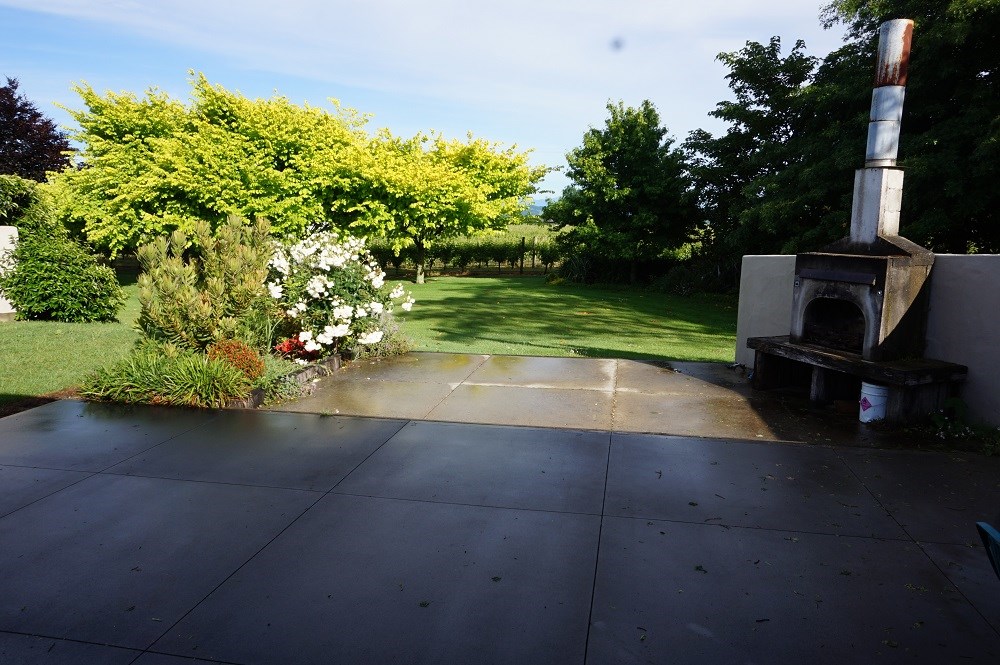 Patio with outdoor fire looking towards vineyard