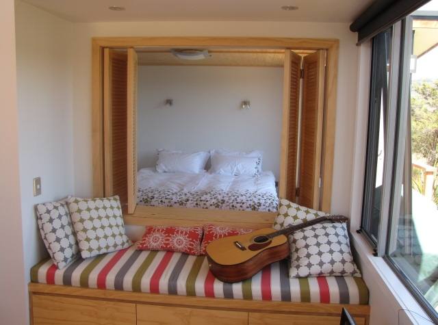 Looking into shuttered second bedroom from living