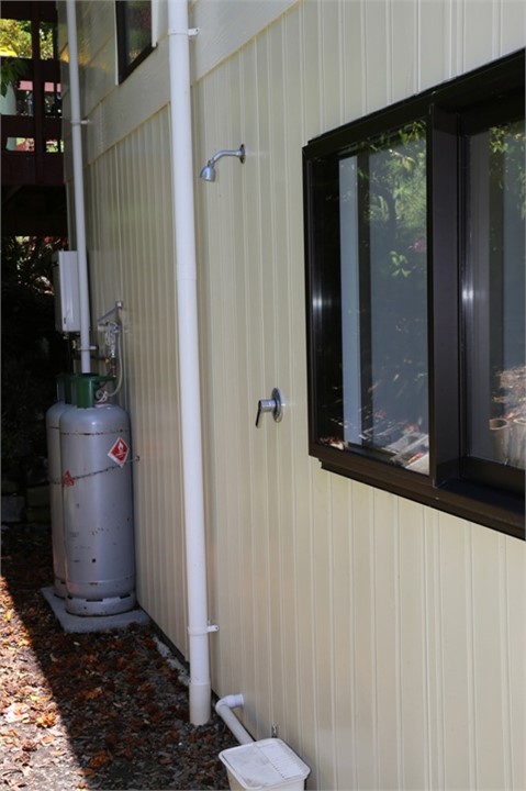 Outside shower to wash sand off before going insid