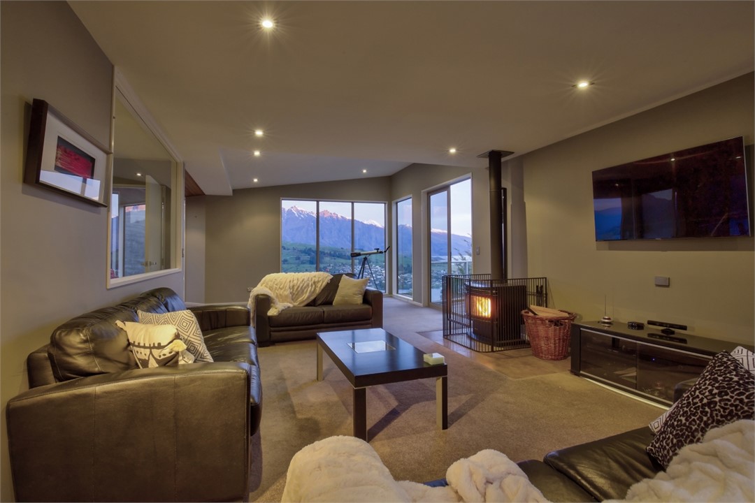 Main living area, comfy leather couches, 55" TV