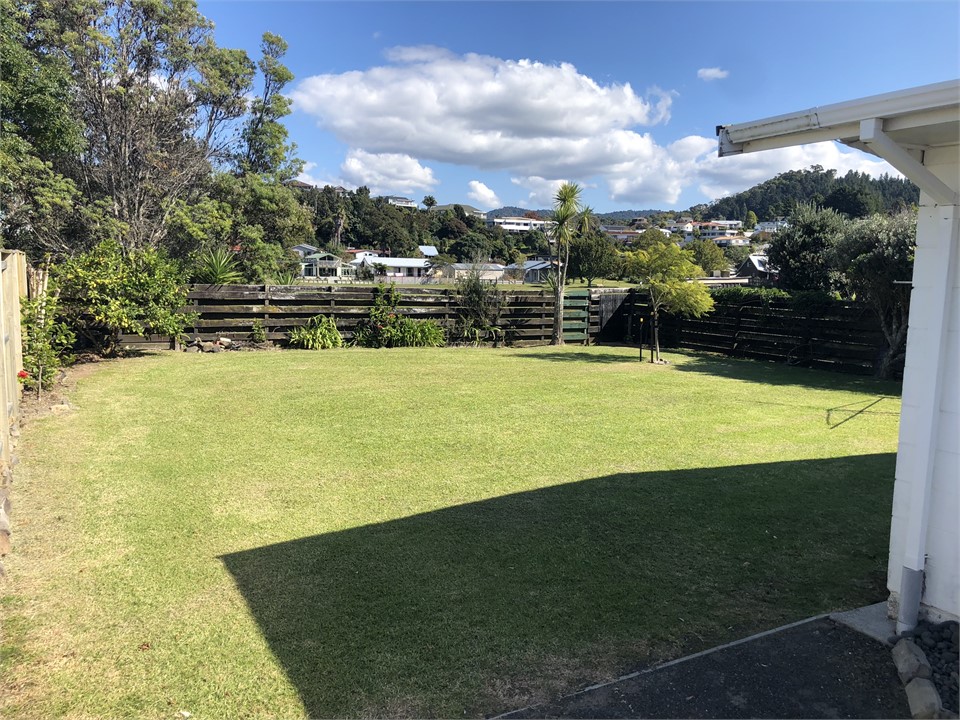 The backyard, plenty of room for parking or tents