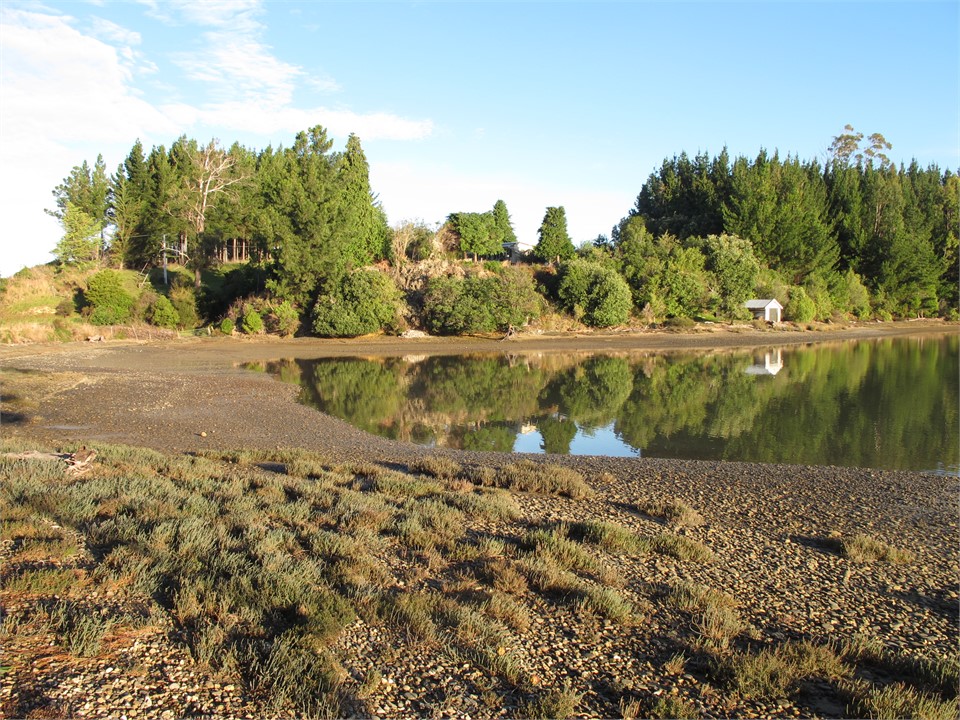View of Harry Place from the shore of Moutere Inle