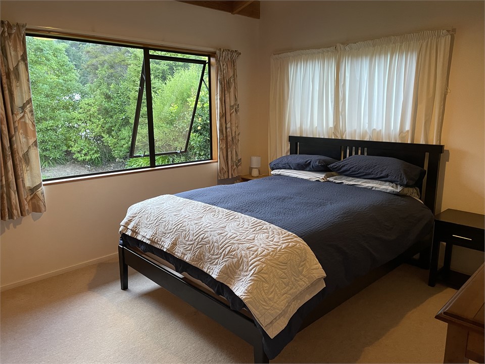Main bedroom looking out to the garden and beach.