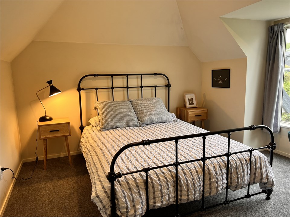 Bedroom 2 has a Queen bed and a desk