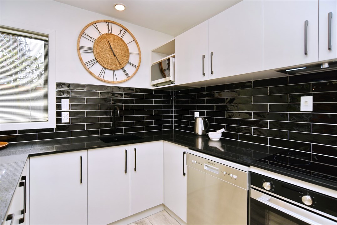 Fully equipped Kitchen area with seating at the be