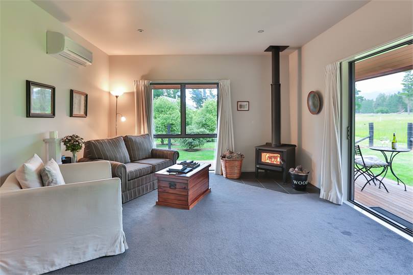 The living room, view to paddocks and mountains