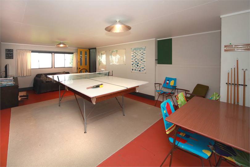 Family room, with tv, table tennis & pool table.