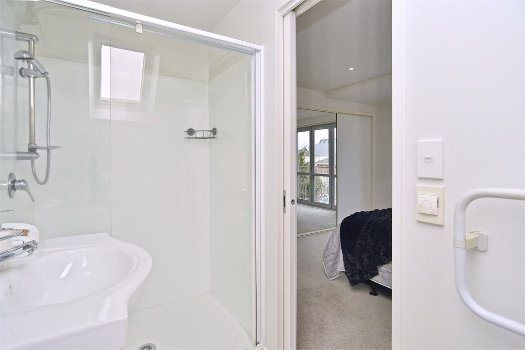 Bathroom 2 has a shower and a toilet