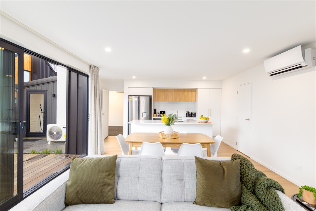 Living room with a TV and seating areas