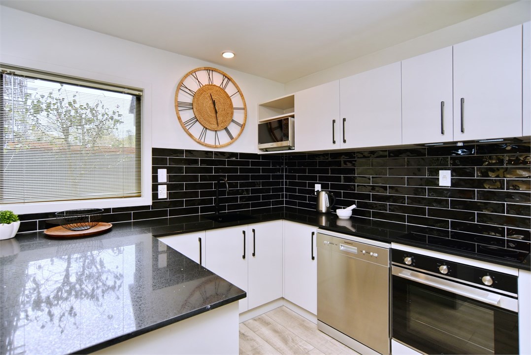 Fully equipped Kitchen area with seating at the be