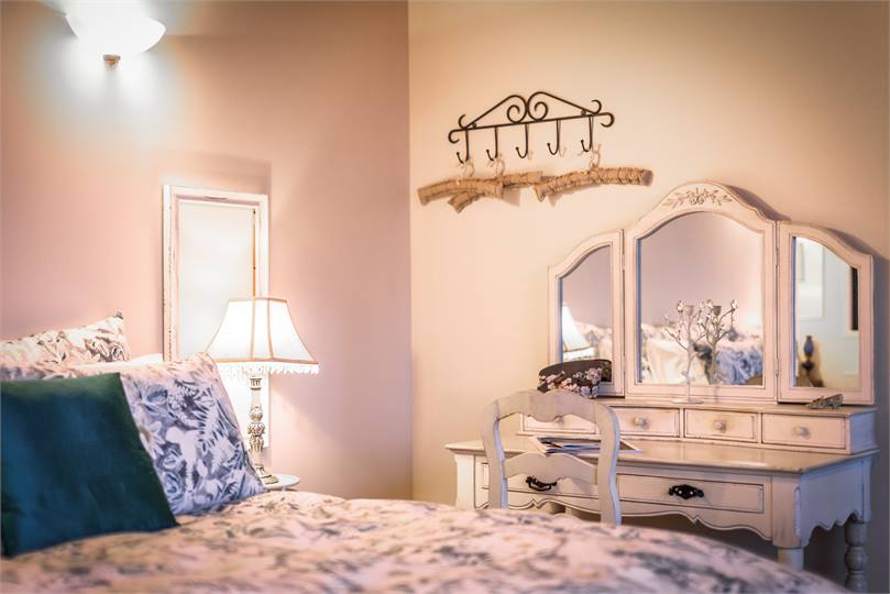 Luxurious bedroom is French country chic