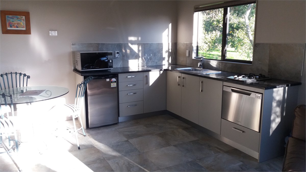 Kitchen with dishwasher and dining