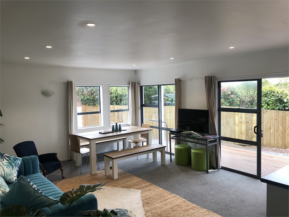 Lounge & dining flow to decks with BBQ, lounger & 