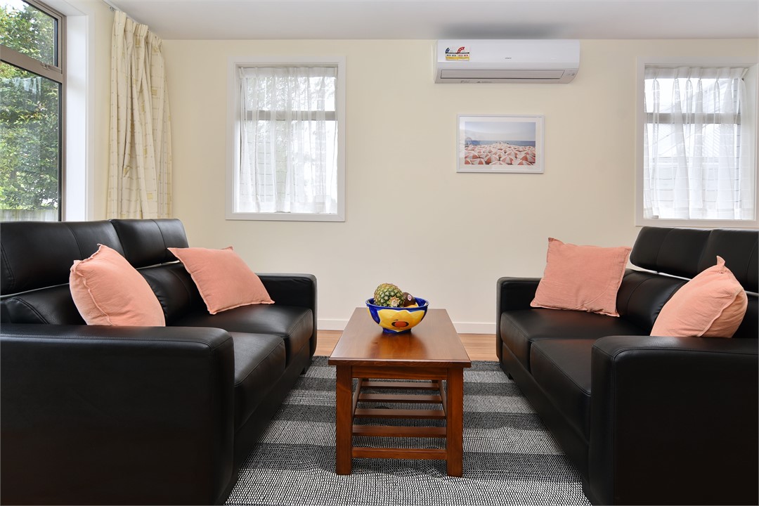 The lounge includes a comfy seating area and a hea