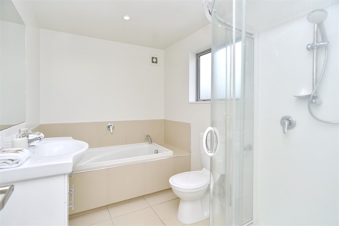 Bathroom 3 has a shower, bath and a toilet