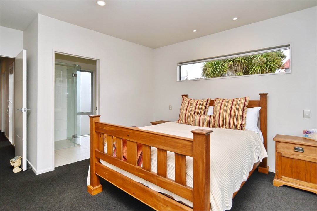 Bedroom 3 has a Queen bed and a seating area