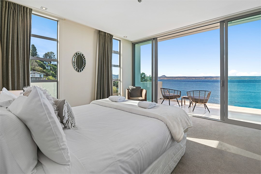 Master bedroom with ensuite and lake views