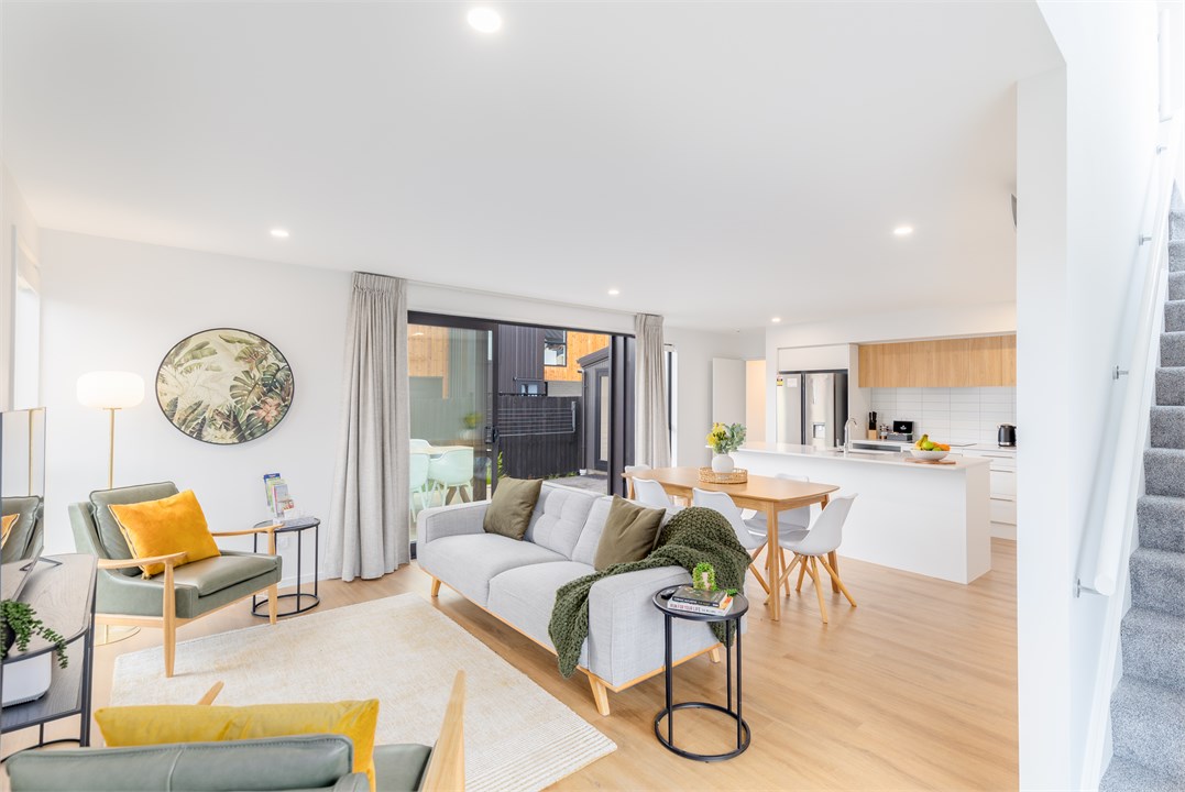 Living room with a TV and seating areas