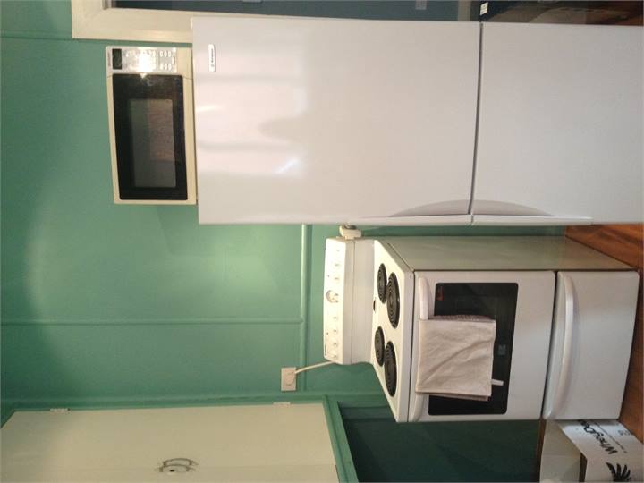 Fully equipped kitchen with oven, fridge and micro