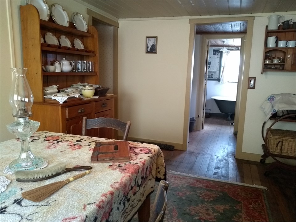 Dinning room view thru Scullery to bath tub end ro