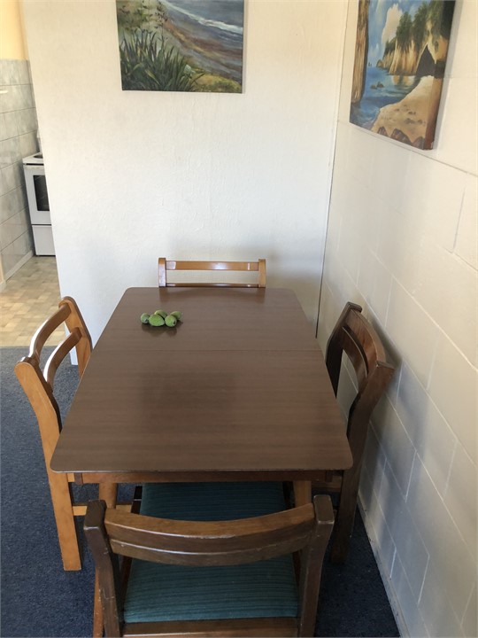 Dining table. Note: Table extends out