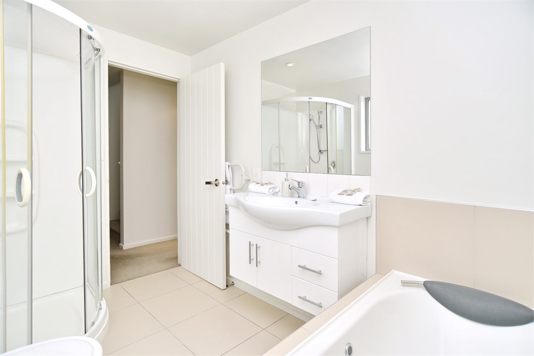 Bathroom 3 has a shower, bath and a toilet