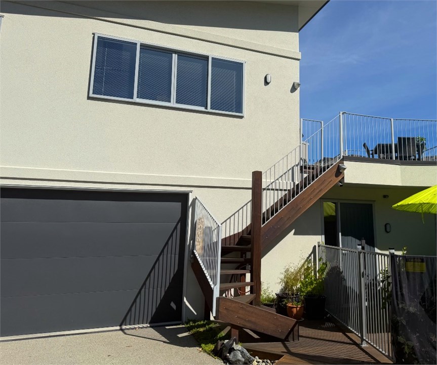 Up the wooden steps to the flat above the garage