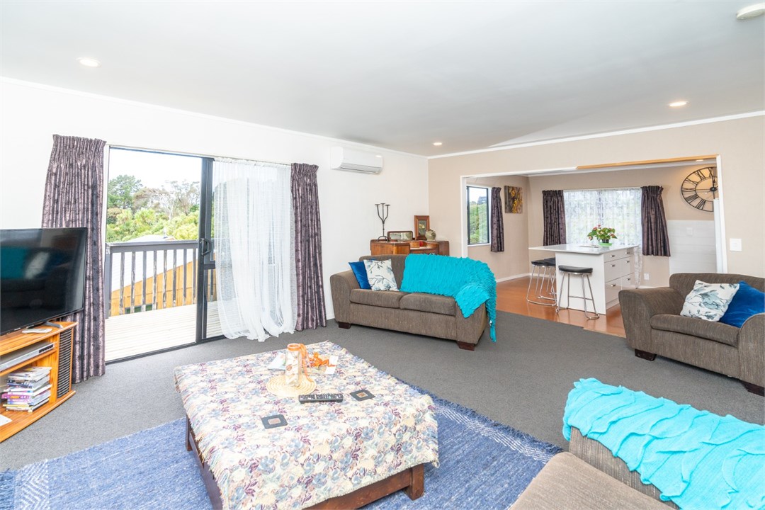 Sunny upstairs lounge with easy flow out to the de