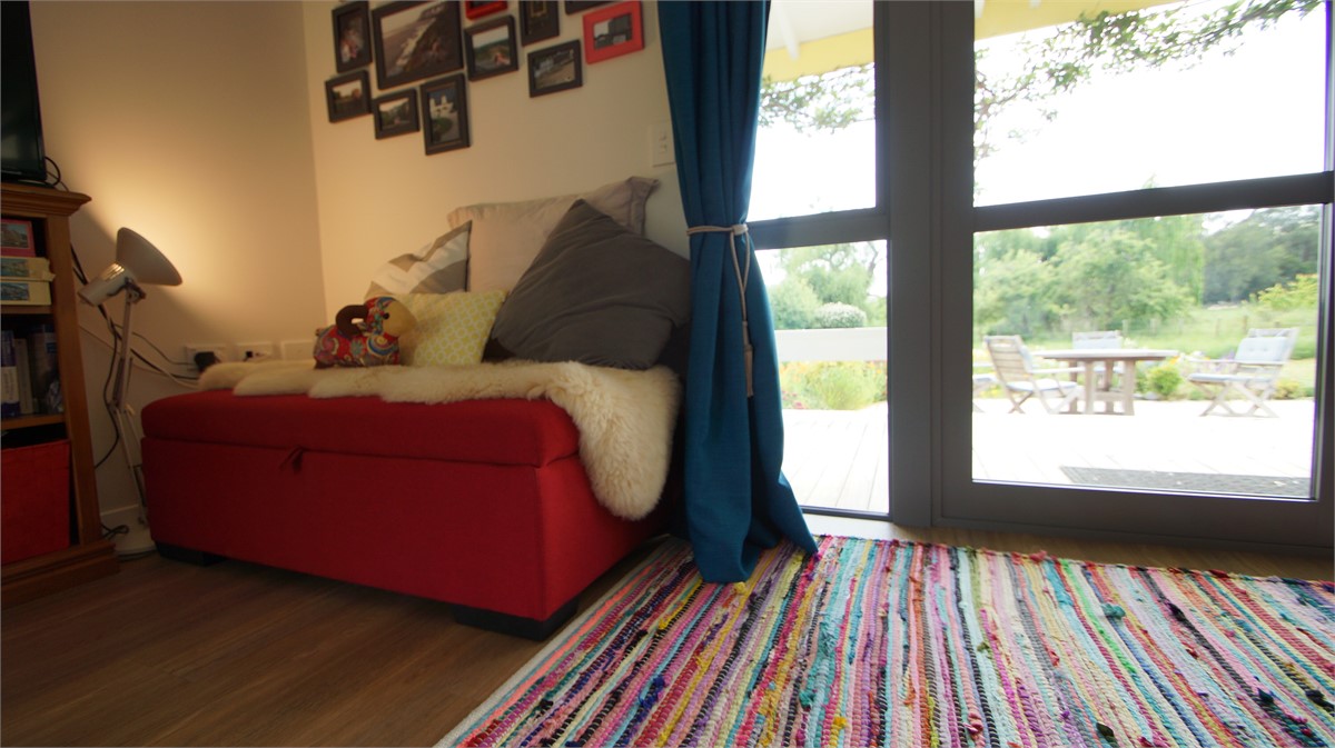 Harold rests on the extra single bed under his pic