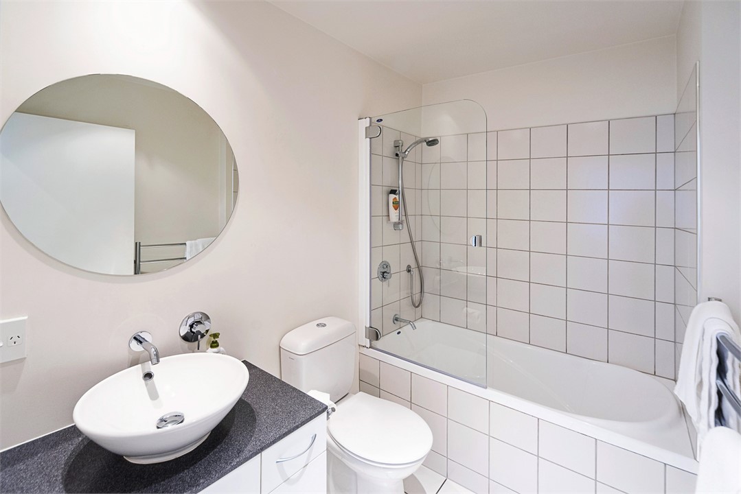 Main Bathroom with Shower over Full-Bath, Toilet