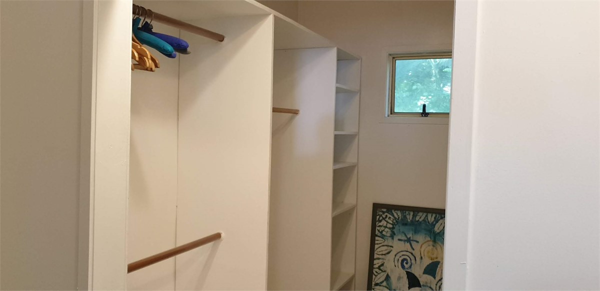 Spacious walk in wardrobe