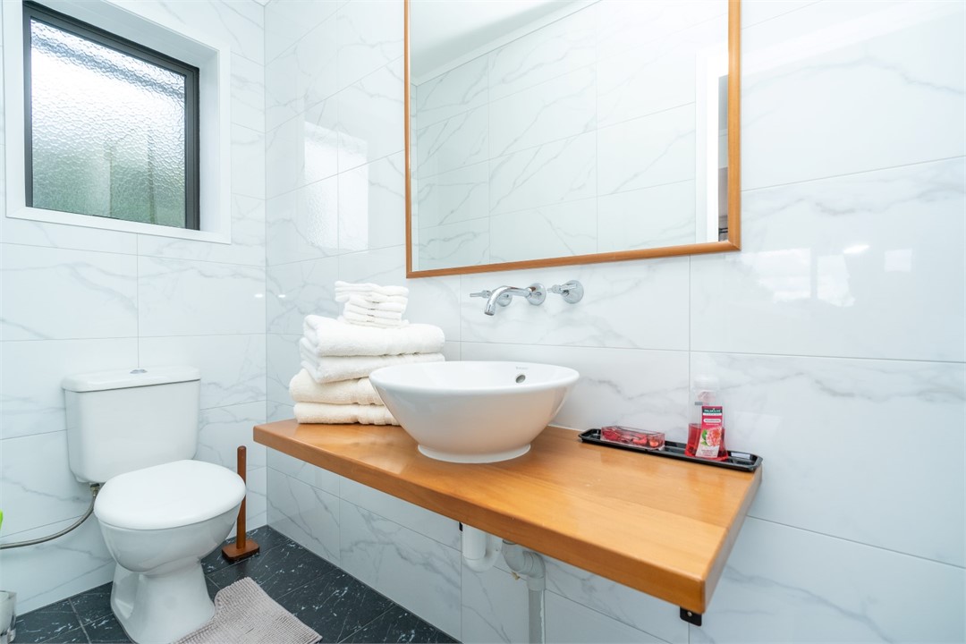 Bathroom has a shower and a toilet