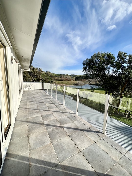 Balcony adjoining upstairs bedrooms.  So sunny and