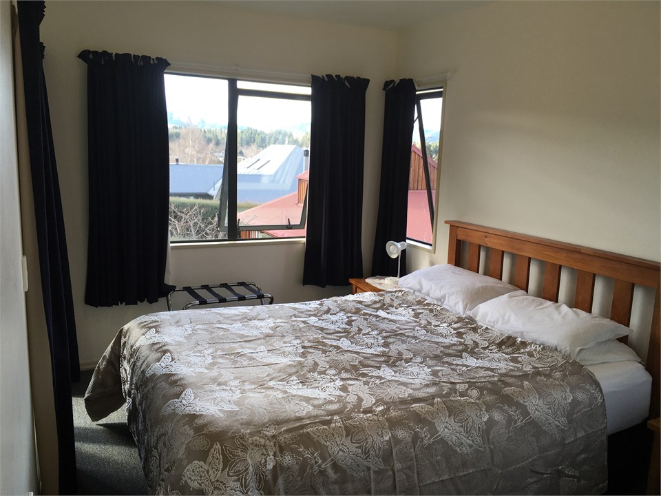 Queen bed opening to deck