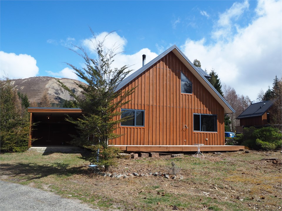 Showing carport and parking area