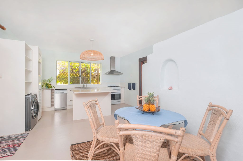 Kitchen and dining with dishwasher and washing mac