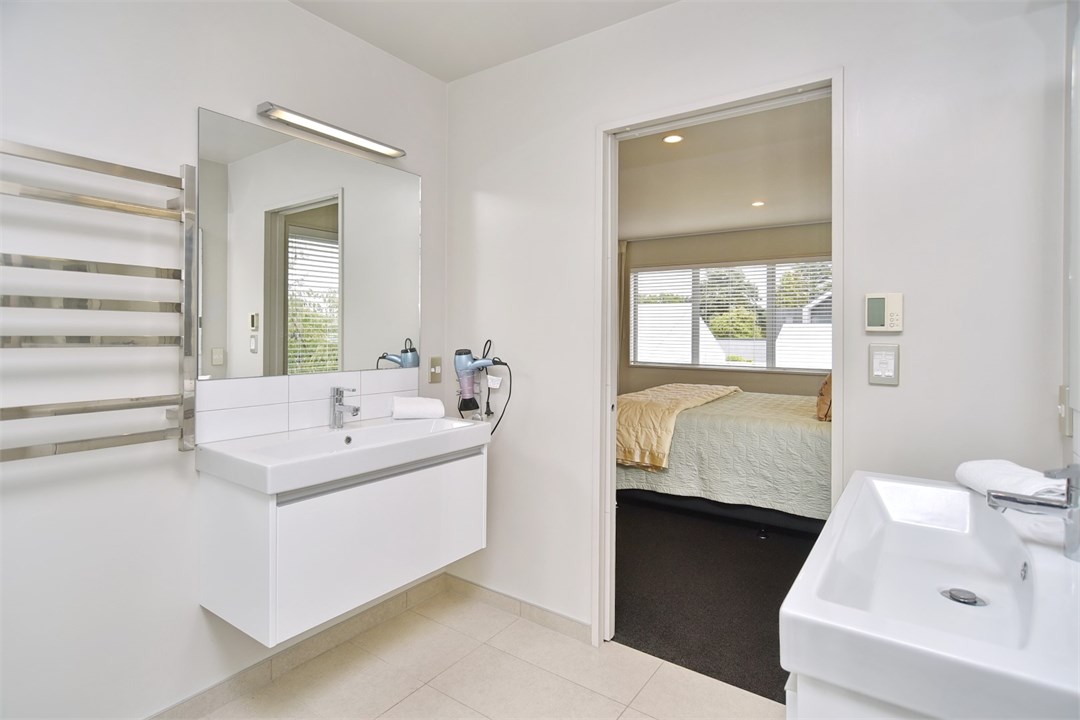 Bathroom 1 is an ensuite and has a shower and a to