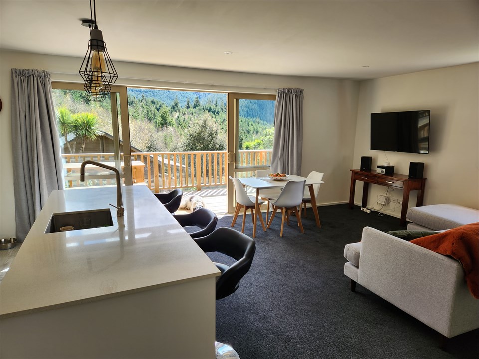 View from kitchen out to deck and mountains