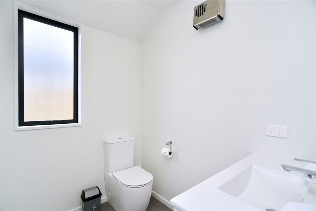 Bathroom 2 has a shower and a toilet