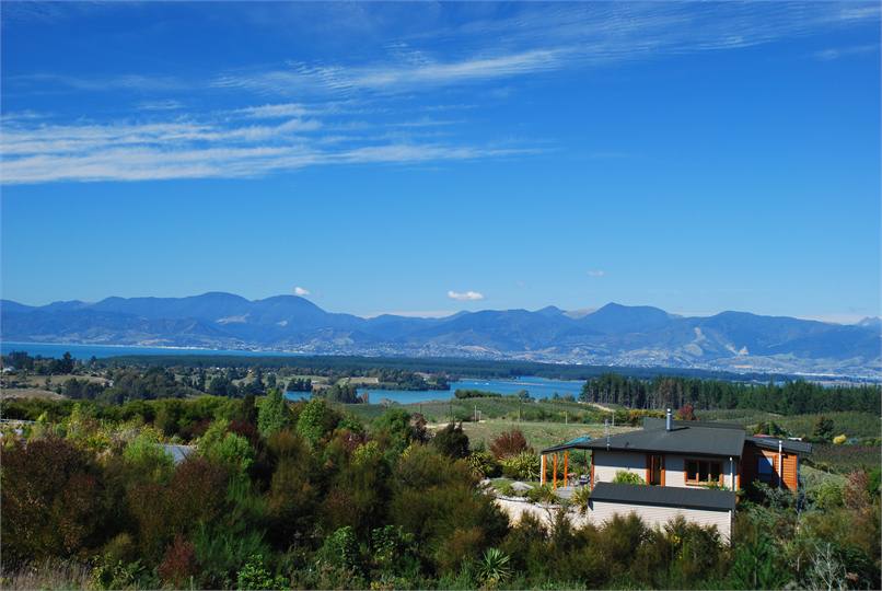 View of cottage and estuary from Old Coach Road