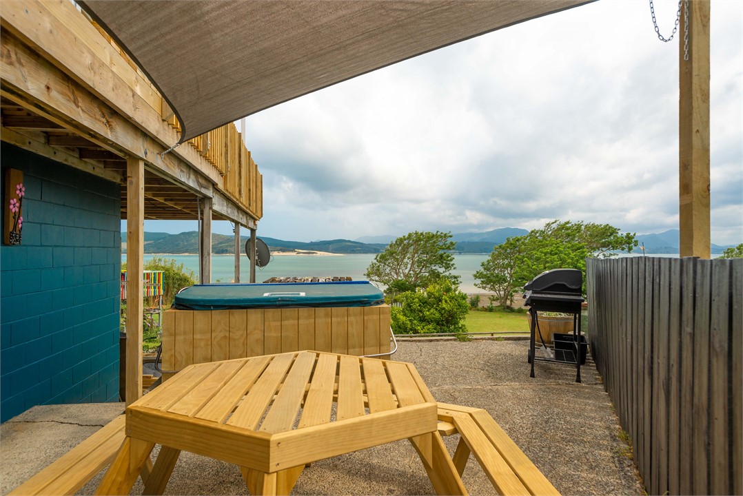 Downstairs SpaPool Terrace with BBQ Table & water 
